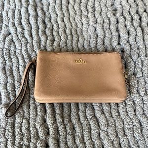 Coach wristlet skin tone/lite peach color